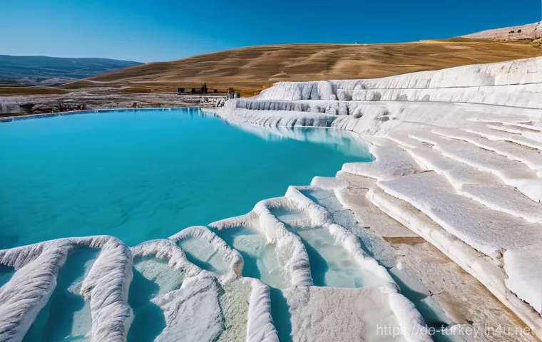 튀르키예의 주요 자연 관광지 - **Pamukkale: White Wonderland with Ancient Echoes**
    A wide-angle, bright, and vibrant photograph...